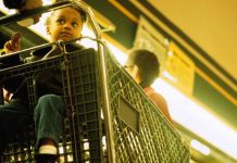 child in shopping cart