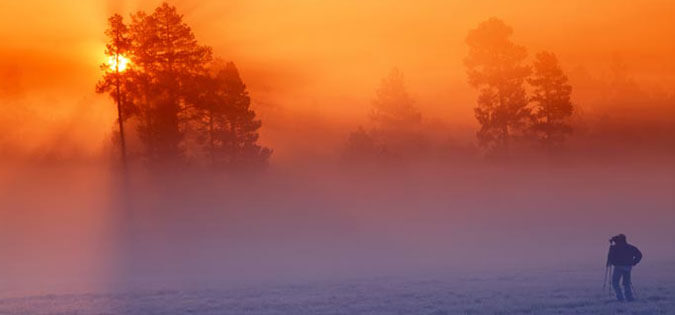 photographer capturing sunrise