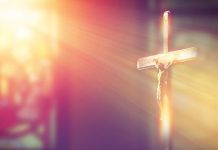 light shines on crucifix