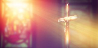 light shines on crucifix