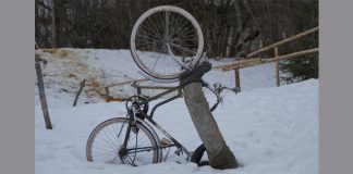 person and bike stuck in snow