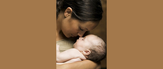 mother holding baby