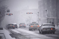 cars driving through the snow