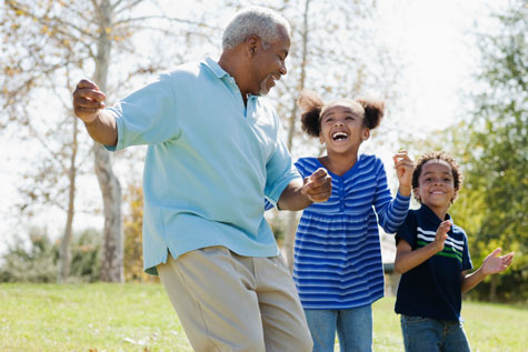 man playing with children