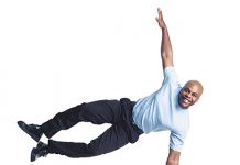 man balancing on sign - 5 Tips for Discerning Balance in a Busy Life