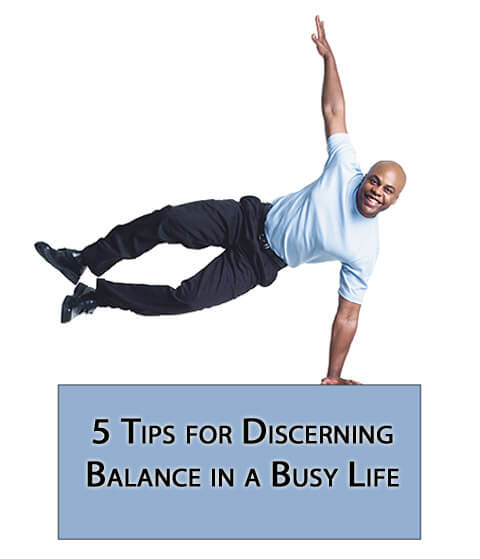 man balancing on sign - 5 Tips for Discerning Balance in a Busy Life