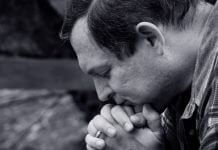 man in silent prayer
