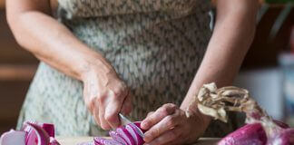 woman cutting onions - Westend61/Getty Images