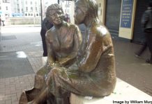statue of women talking - photo by William Murphy under CC BY-SA 2.0