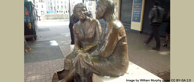 statue of women talking - photo by William Murphy under CC BY-SA 2.0