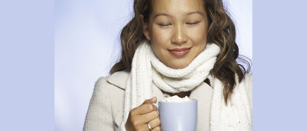 woman enjoying hot chocolate