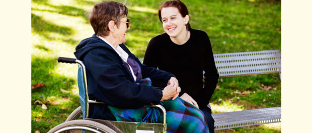 intergenerational friends talking in the park