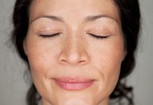 close-up face of woman in prayer