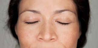 close-up face of woman in prayer