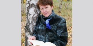 woman outdoors with book