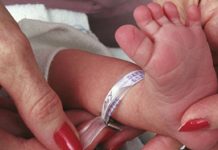 touching baby's feet