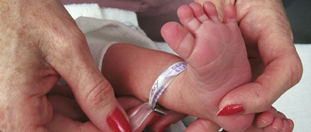 touching baby's feet