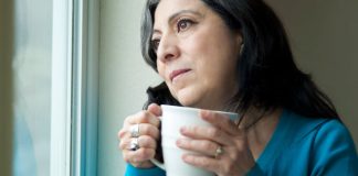 woman alone at window