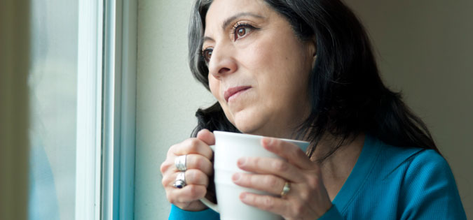 woman alone at window