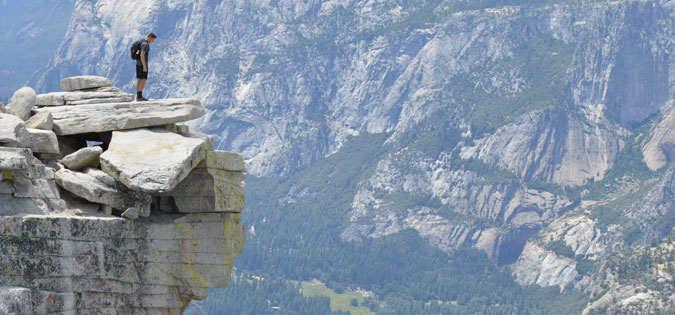 man standing on rock