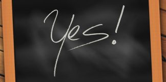 word "yes" written on a chalkboard