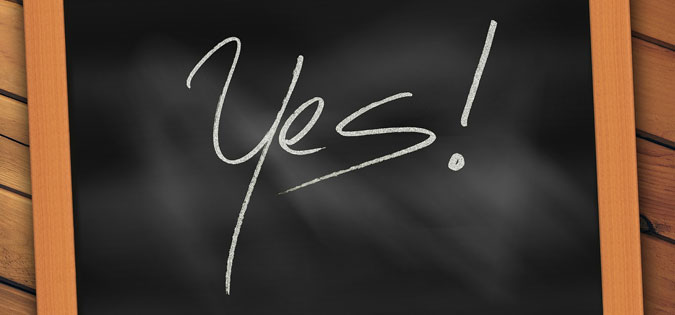 word "yes" written on a chalkboard