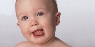 baby with tongue out - tasting the breeze