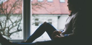 girl staring out window