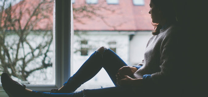 girl staring out window