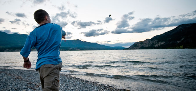 throwing rock into water