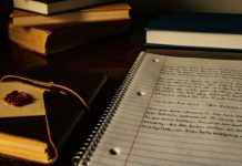 journals and other books and papers on desk