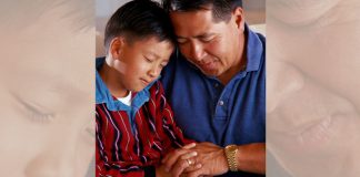 father and son praying together