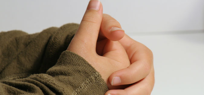 close-up on boy's hands in prayer