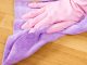 gloved hand cleaning house