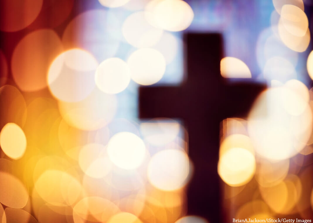 cross and lights - BrianAJackson/iStock/Getty Images