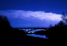 dark sky over bridge