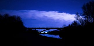 dark sky over bridge