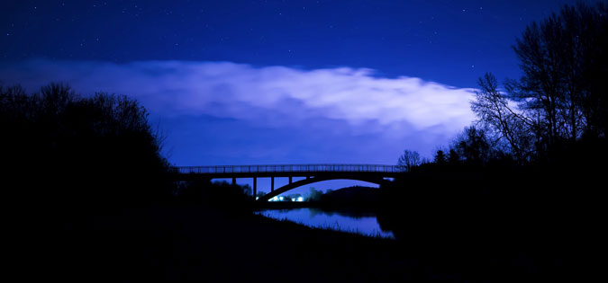 dark sky over bridge