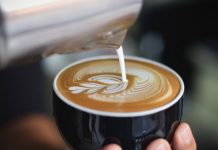 barista pouring coffee