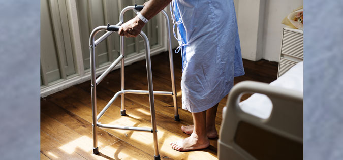 person with walker in hospital