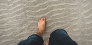 barefoot on beach - photo by Clint McKoy on Unsplash