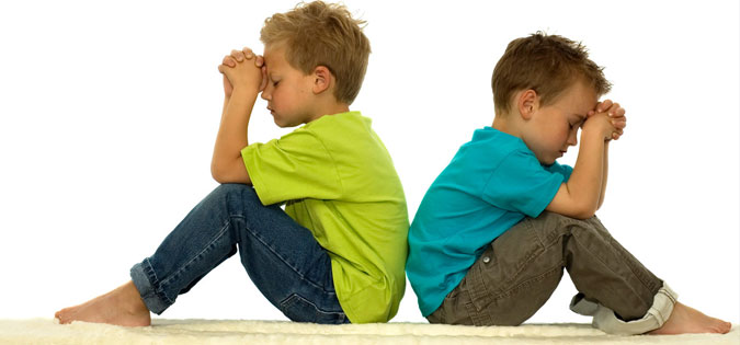 boys sitting in silent prayer