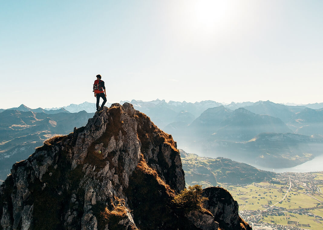 person on top of mountain after hiking - image by StockSnap from Pixabay