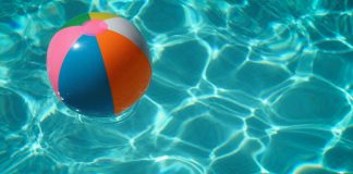 beach ball in swimming pool - photo by Raphaël Biscaldi on Unsplash