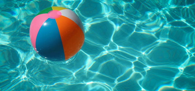 beach ball in swimming pool - photo by Raphaël Biscaldi on Unsplash