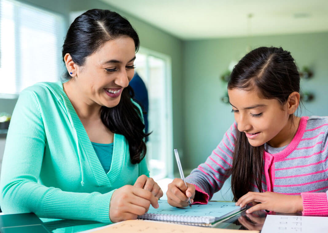 mother and daughter working on homework