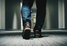 man walking in hallway - photo by Farrel Nobel on Unsplash