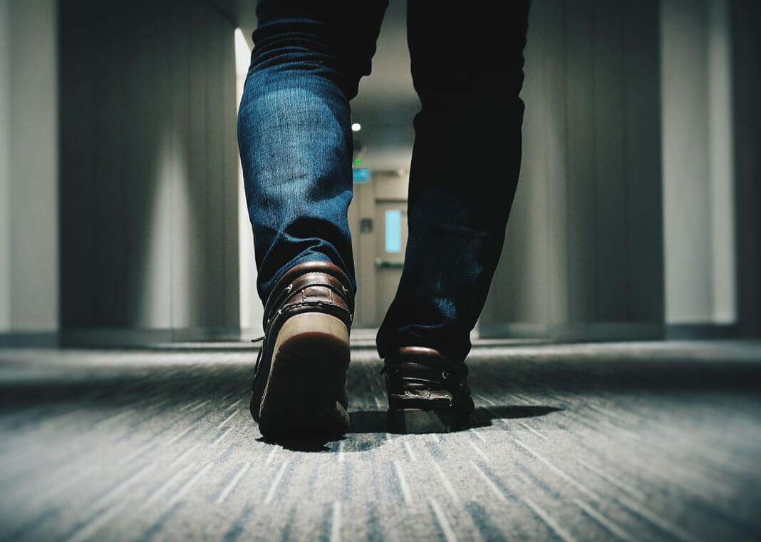 man walking in hallway - photo by Farrel Nobel on Unsplash