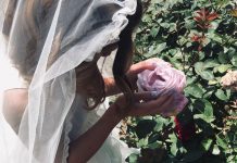 First Communicant with rose - photo courtesy of Loretta Pehanich