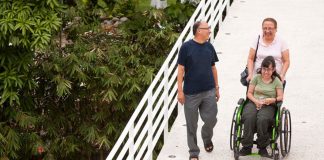 5 Gifts of Ignatian Spirituality for the Aging - text over image of people walking on bridge